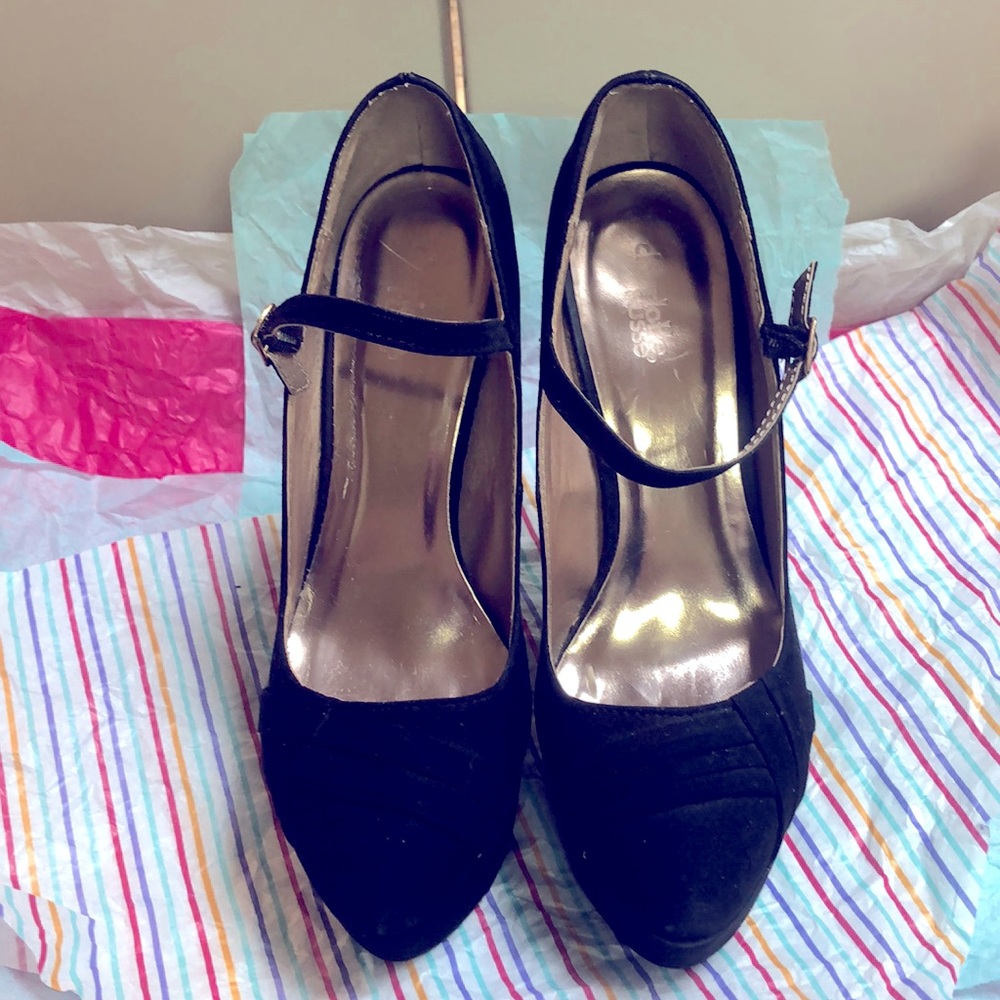 Black platform heels with fabric detail on toe